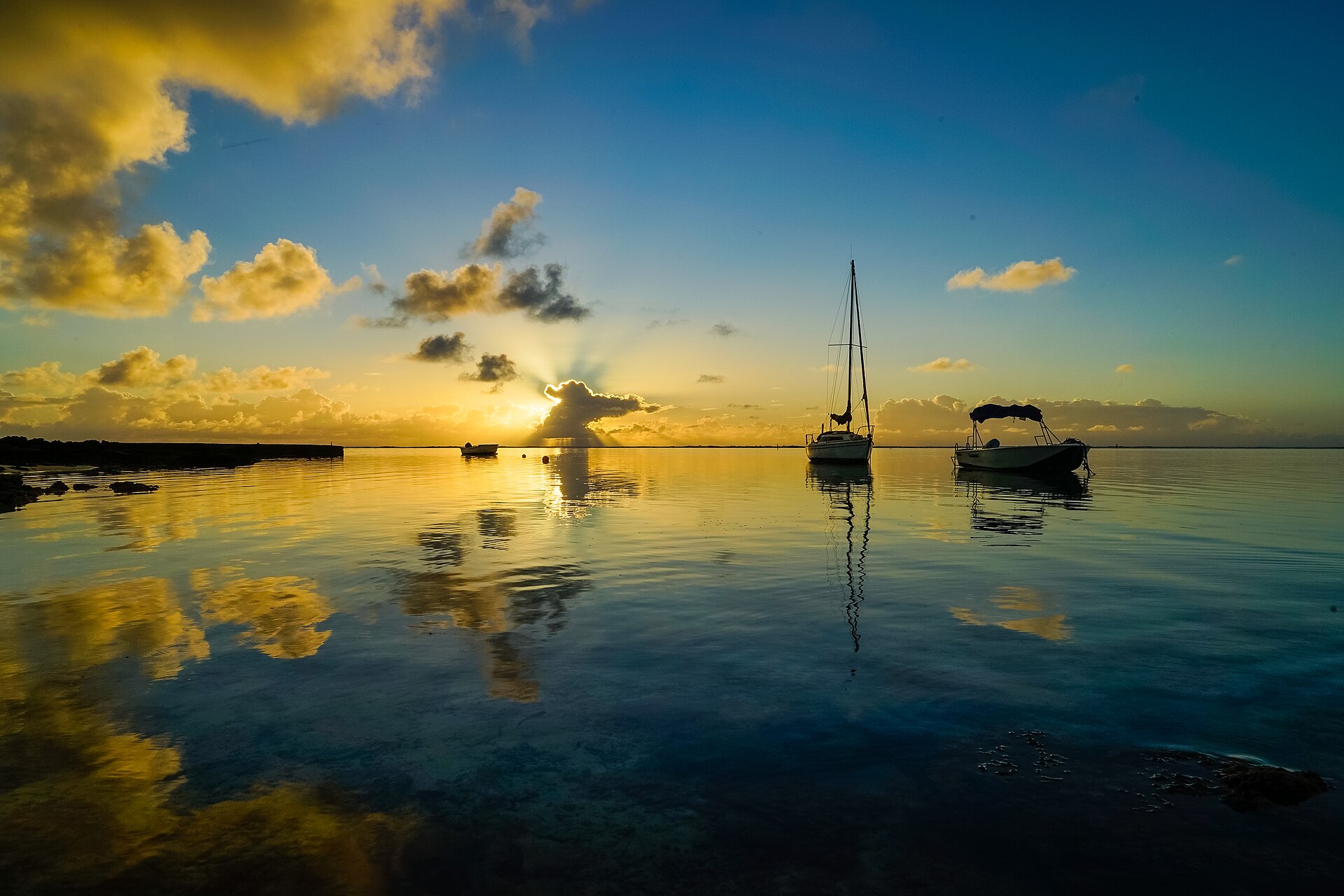 Dawn over boats near Blue Bay
